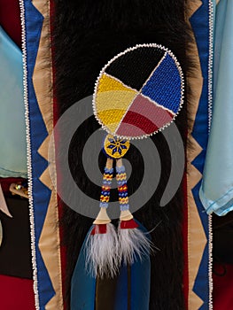 Yellow, Red, Blue, and Black Seed Bead Medallion on Pow Wow Regalia