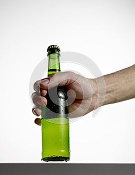 Hand with beer bottle