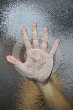 Hand behind the glass