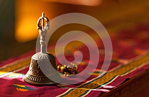 Hand bell, in sunlight inside a temple