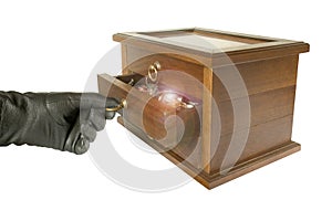 Hand in black glove opening casket with jewelry