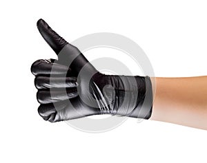 Hand in black glove showing gesture of like sign, giving thumb up on white
