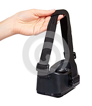 Hand with black plastic VR headset, Virtual Reality mask