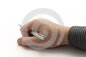 Hand with black shirt holding silver metal pen