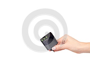 Hand with black USB wall chrger plug, three ports