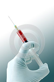 Hand with blood Syringe