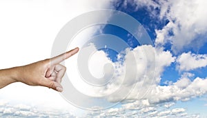 Hand on the blue clear sky