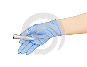 Hand in blue glove holding dental tool