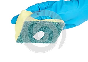Hand in blue glove with sponge