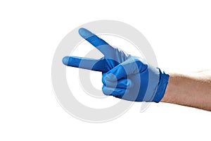 Hand in blue rubber glove showing gesture symbol, on white isolate