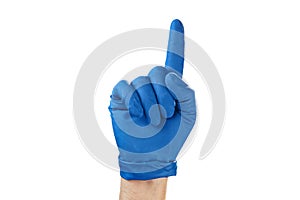 Hand in blue rubber glove showing gesture symbol, on white isolate