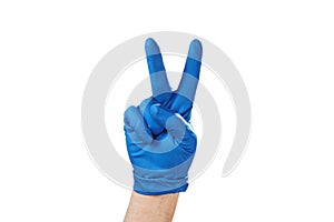 Hand in blue rubber glove showing gesture symbol, on white isolate