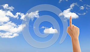 Hand with blue sky and white cloud