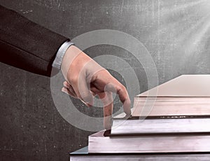 Hand and book stairs