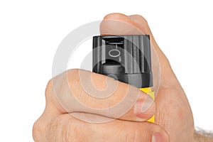 Hand with bottle of pepper spray