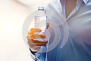 hand with bottle of water