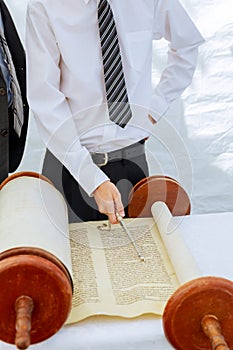 Hand of boy reading the Jewish Torah at Bar Mitzvah 5 SEPTEMBER 2016