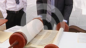 Hand of boy reading the Jewish Torah at Bar Mitzvah Torah reading 5 SEPTEMBER 2016