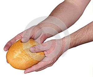 Hand breaking apart a bread