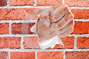 Hand breaking through wall
