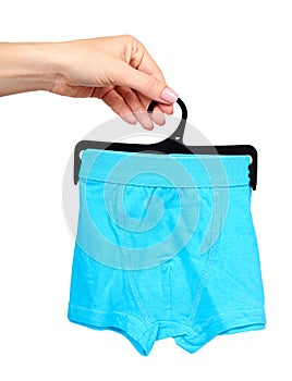 Hand with bright boxer underwear, cotton pants