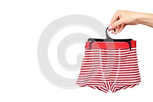 Hand with bright striped boxer underwear. Isolated