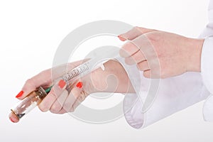 Hand brings syringe