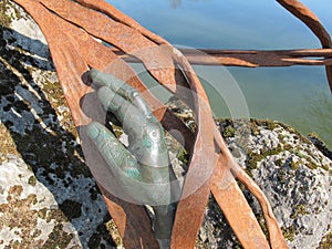Hand bronze statue inside the park of Majolan Blanquefort France