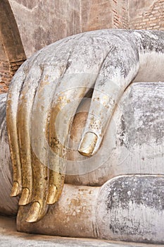 Hand of Buddha in of Sukhothai ancient city.