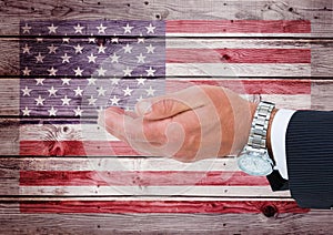 hand of business man against american flag