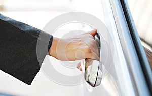 Hand business woman open car door