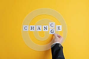 Hand of a businessman changing the word Chance into Change