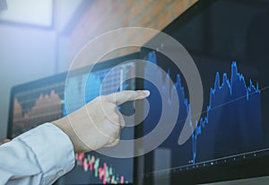 Hand of businessman group pointing and look directions change Average line Share price movement Stock trading in the up and down.