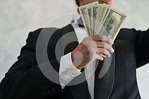 Hand of a businessman holding cash are successful in business, w