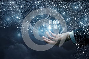 Hand of a businessman in the network shows the block chain .