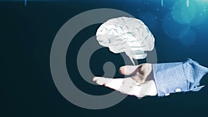 Hand of a businessman raises computer brain