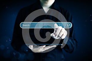 Hand of businessman touching magnifying glass icon search