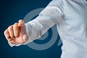 Hand of a businessman touching virtual interface screen