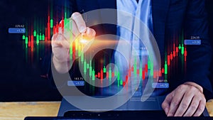 Hand of businessman or trader is touching growing virtual hologram stock, planning and strategy, Stock market, Business growth,