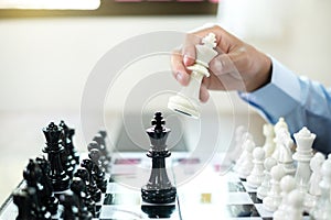 hand of businessmen moving chess in competition shows leadership, followers and business success strategies