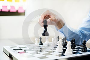 hand of businessmen moving chess in competition shows leadership, followers and business success strategies