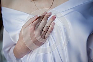 Hand on a bust of a woman in a peignoir