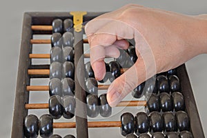 Hand calculated on wooden abacus photo
