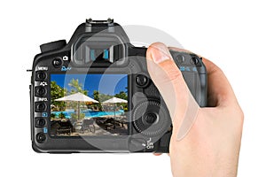 Hand with camera and Nusa Dua in Bali Indonesia my photo