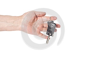 Hand with a car keys isolated on white