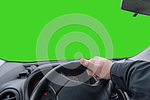 Hand on a car steering wheel. Maneuver on car, make a sharp left turn. Green screen. copy space