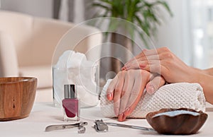 Hand care in the spa. Beautiful manicure, woman`s hands in the spa