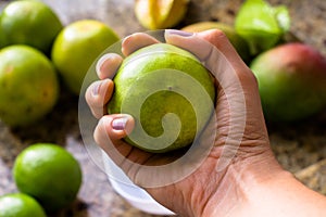 Hand caring orange fresh fruit