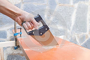 Carpenter sawing