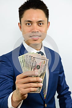 Hand carrying currency note spread out